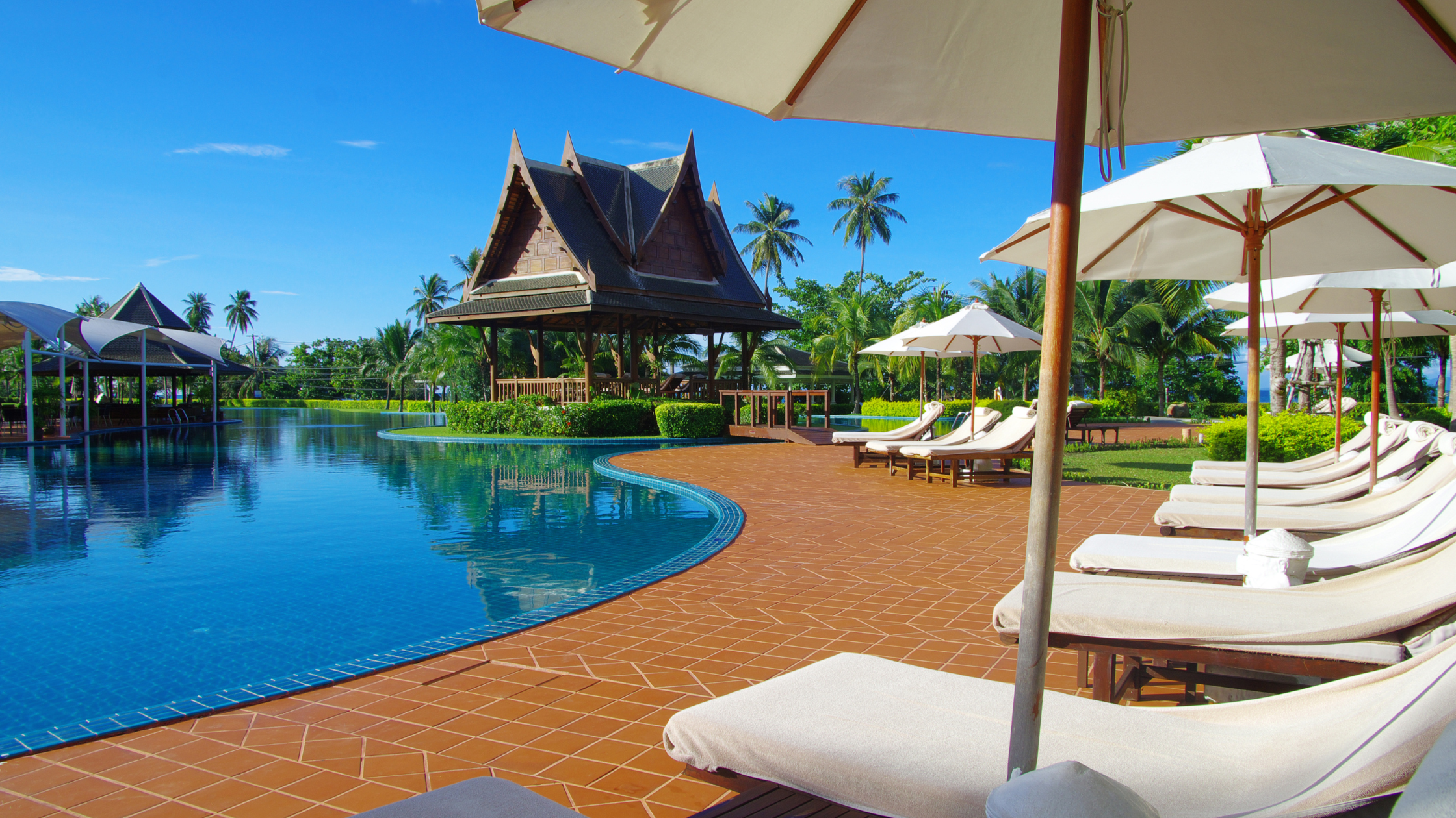 Resort pool with room for families to gather