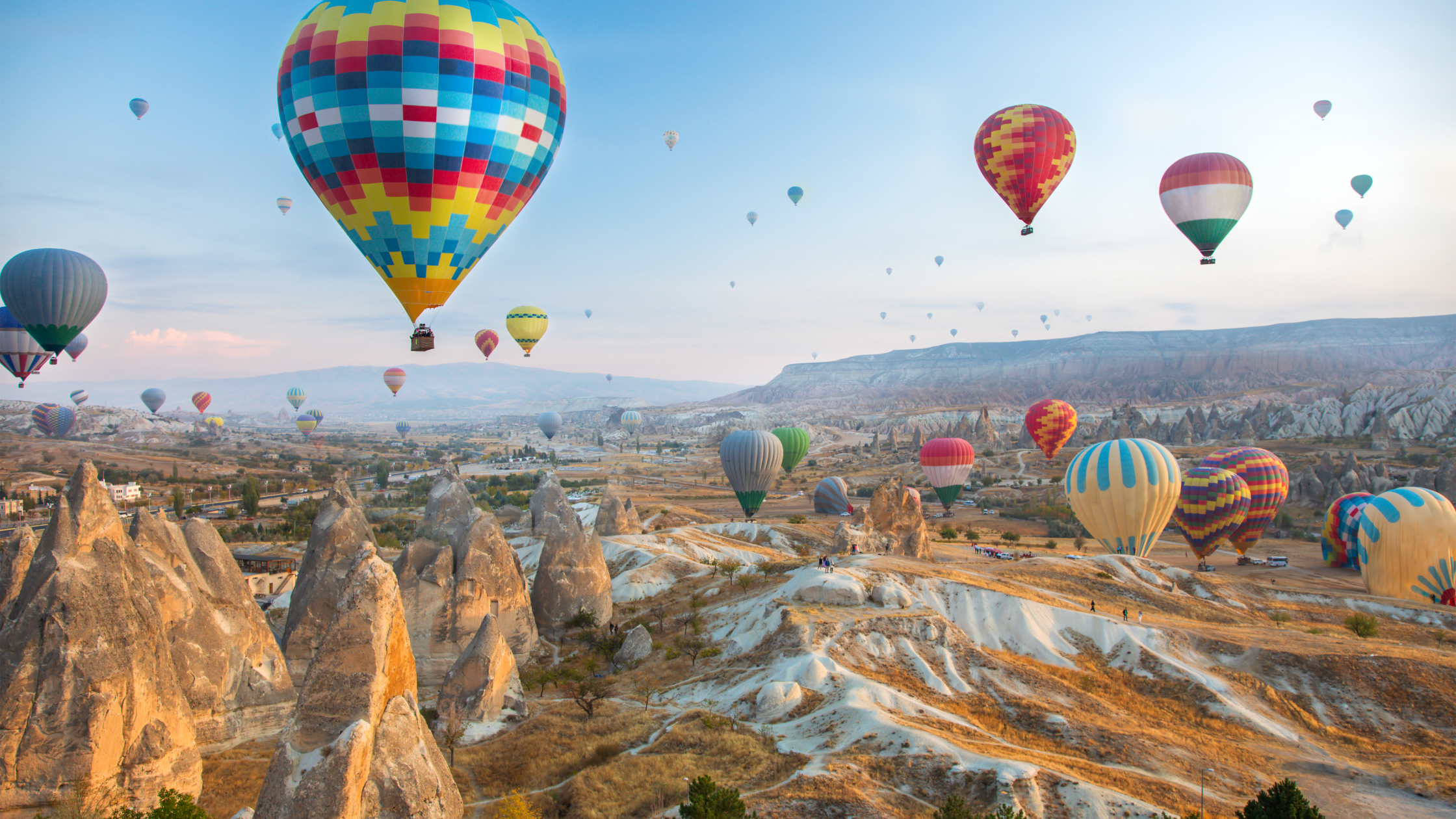 Hot-air balloons floating over an extraordinary landscape